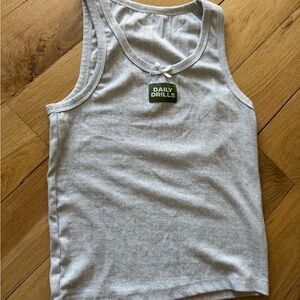 Brand new- worn once ..Daily Drills Light Gray Textured Top. Size M/L